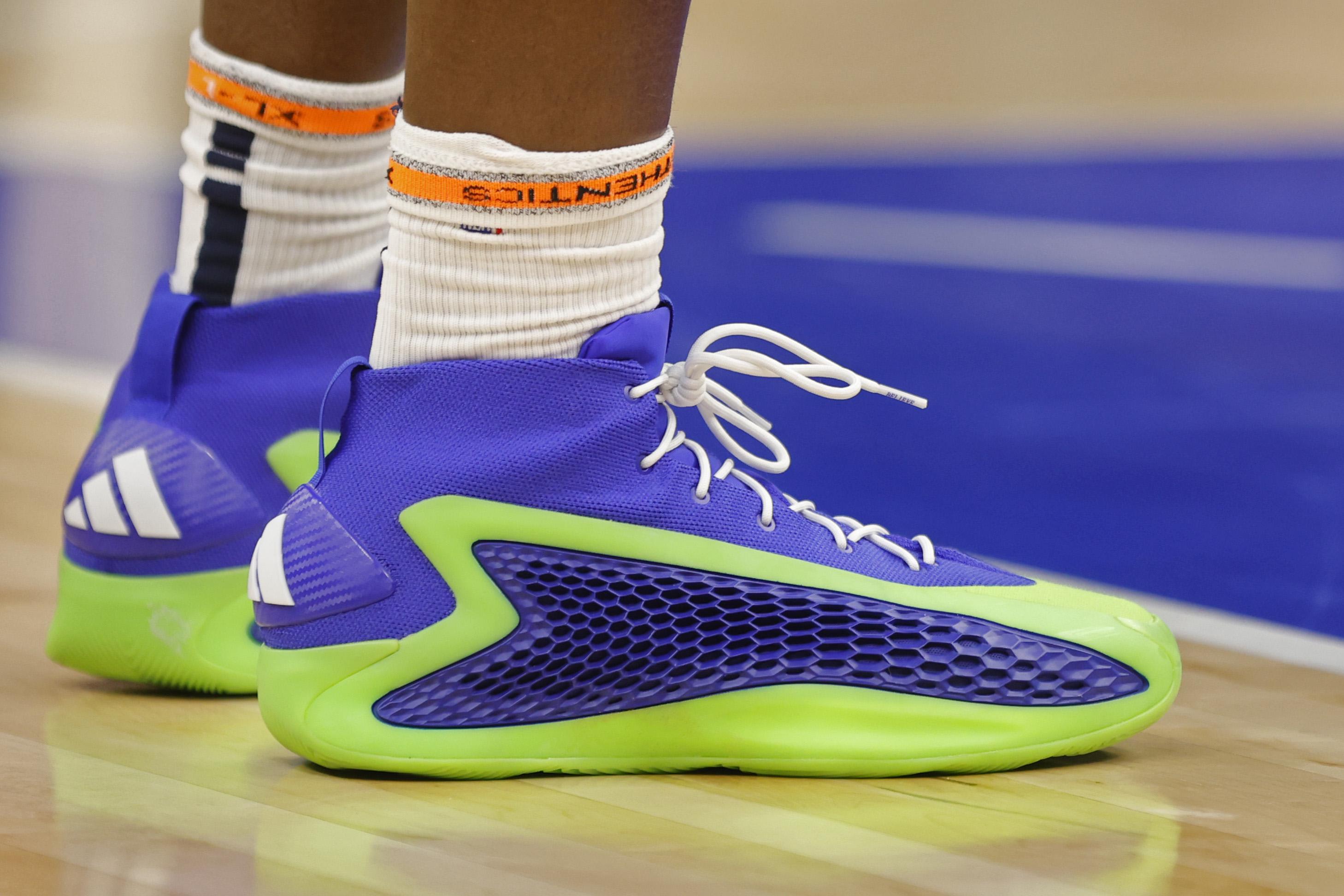 Minnesota Timberwolves guard Anthony Edwards' blue and green adidas sneakers.