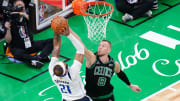 Jun 9, 2024; Boston, Massachusetts, USA; Boston Celtics center Kristaps Porzingis (8) blocks Dallas Mavericks center Daniel Gafford (21) in the third quarter during game two of the 2024 NBA Finals at TD Garden. Mandatory Credit: David Butler II-USA TODAY Sports