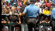 Coastal Carolina coach Kevin Schnall argues with umpires during the Men's College World Series final on June 22, 2025.