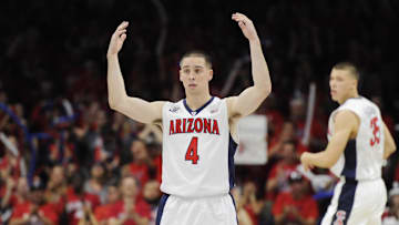 Mar 7, 2015; Tucson, AZ, USA; Arizona Wildcats guard T.J. McConnell (4) signals to the crowd during the second half against the Stanford Cardinal at McKale Center. Arizona won 91-69 to win the regular season Pac-12 championship. Mandatory Credit: Casey Sapio-Imagn Images