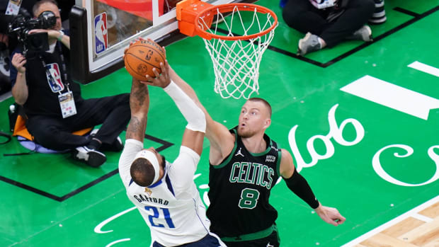 Boston Celtics center Kristaps Porzingis blocks Dallas Mavericks center Daniel Gafford in the 2024 NBA Finals.