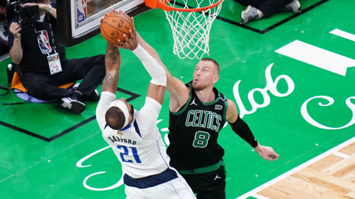 Jun 9, 2024; Boston, Massachusetts, USA; Boston Celtics center Kristaps Porzingis (8) blocks Dallas Mavericks center Daniel Gafford (21) in the third quarter during game two of the 2024 NBA Finals at TD Garden. Mandatory Credit: David Butler II-USA TODAY Sports