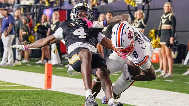 Auburn wide receiver Cam Coleman (8) catches a touchdown pass in front of Vanderbilt cornerback Martel Hight (4) during the fourth quarter at FirstBank Stadium in Nashville, Tenn., Saturday, Nov. 8, 2025.