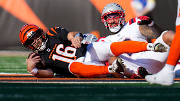 Nov 23, 2025; Cincinnati, Ohio, USA; Cincinnati Bengals quarterback Joe Flacco (16) is sacked on third down in the first quarter against the New England Patriots at Paycor Stadium. Mandatory Credit: Sam Greene-USA TODAY Network via Imagn Images