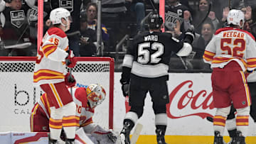 Apr 17, 2025; Los Angeles, California, USA;   Los Angeles Kings forward Taylor Ward (52) scores past Calgary Flames goaltender Dan Vladar (80) in the third period at Crypto.com Arena. Mandatory Credit: Jayne Kamin-Oncea-Imagn Images