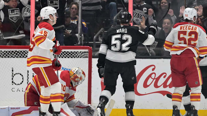 Apr 17, 2025; Los Angeles, California, USA;   Los Angeles Kings forward Taylor Ward (52) scores past Calgary Flames goaltender Dan Vladar (80) in the third period at Crypto.com Arena. Mandatory Credit: Jayne Kamin-Oncea-Imagn Images