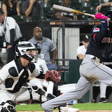 Sep 10, 2024; Chicago, Illinois, USA;  Cleveland Guardians second baseman Andres Gimenez (0) hits a RBI single against the Chicago White Sox during the ninth inning at Guaranteed Rate Field. Mandatory Credit: Matt Marton-Imagn Images