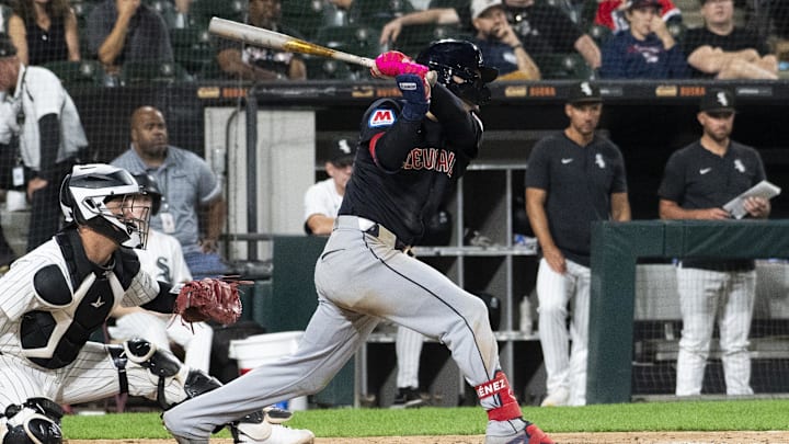 Sep 10, 2024; Chicago, Illinois, USA;  Cleveland Guardians second baseman Andres Gimenez (0) hits a RBI single against the Chicago White Sox during the ninth inning at Guaranteed Rate Field. Mandatory Credit: Matt Marton-Imagn Images