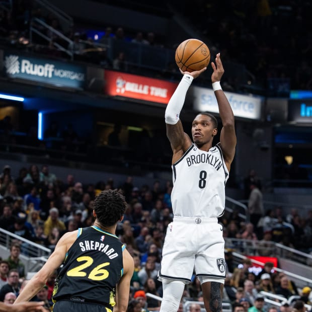 Brooklyn Nets guard Lonnie Walker IV (8) shoots the ball while Indiana Pacers guard Ben Sheppard (26) defends against him.