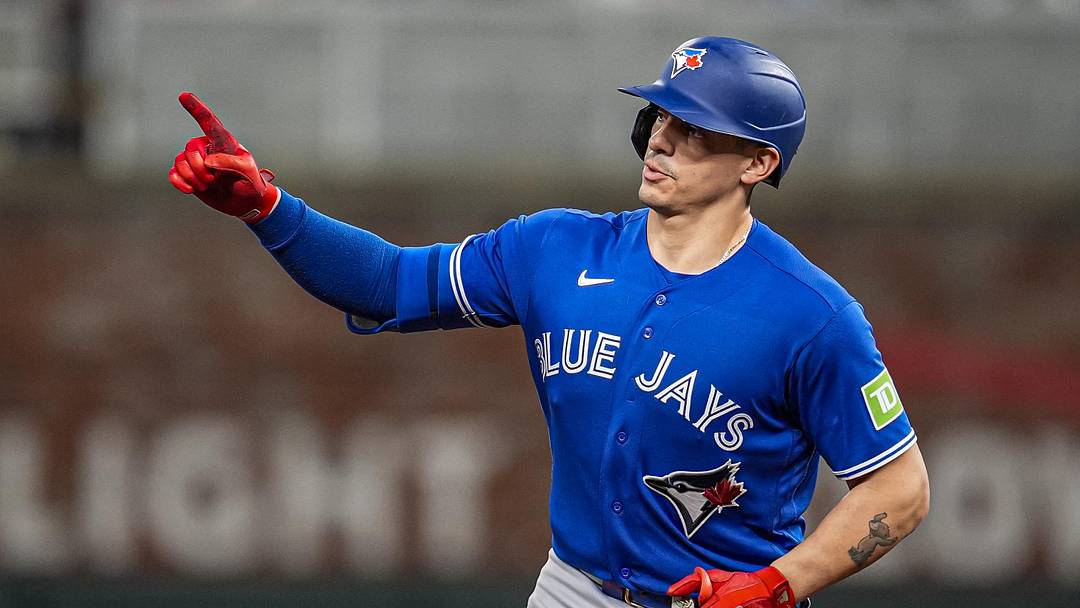 Toronto Blue Jays catcher Brandon Valenzuela reacts after hitting a home run.