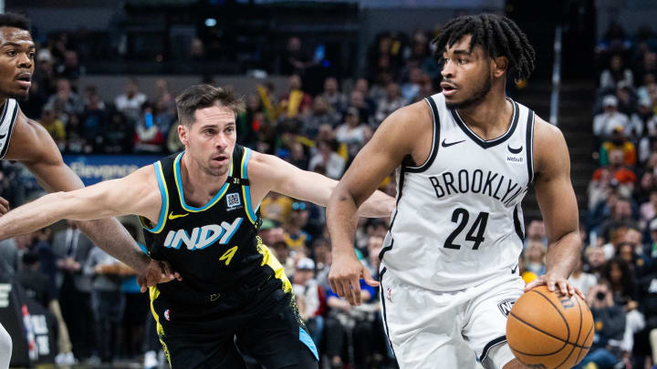 Mar 16, 2024; Indianapolis, Indiana, USA; Brooklyn Nets guard Cam Thomas (24) dribbles the ball while Indiana Pacers guard T.J. McConnell (9) defends in the second half at Gainbridge Fieldhouse. Mandatory Credit: Trevor Ruszkowski-USA TODAY Sports