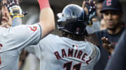 Cleveland Guardians third baseman José Ramírez (11) high fives teammates in the dugout after a home run in the third inning against the Detroit Tigers at Comerica Park on July 29.