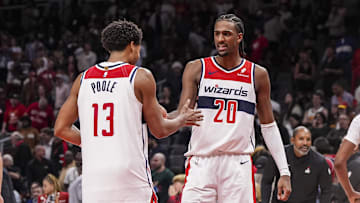 Oct 28, 2024; Atlanta, Georgia, USA; Washington Wizards guard Jordan Poole (13) and forward Alexandre Sarr (20) react after the Wizards defeated the Atlanta Hawks at State Farm Arena. Mandatory Credit: Dale Zanine-Imagn Images