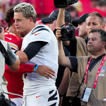 Cincinnati Bengals quarterback Joe Burrow (9) and Kansas City Chiefs quarterback Patrick Mahomes (15) hug at midfield after the fourth quarter of the NFL Week 2 game between the Kansas City Chiefs and the Cincinnati Bengals at Arrowhead Stadium in Kansas City on Sunday, Sept. 15, 2024. The Chiefs took a 26-25 win with a go-ahead field goal as time expired.