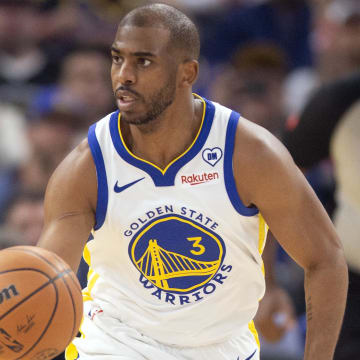 Apr 14, 2024; San Francisco, California, USA; Golden State Warriors guard Chris Paul (3) brings the ball up court against the Utah Jazz during the first quarter at Chase Center.