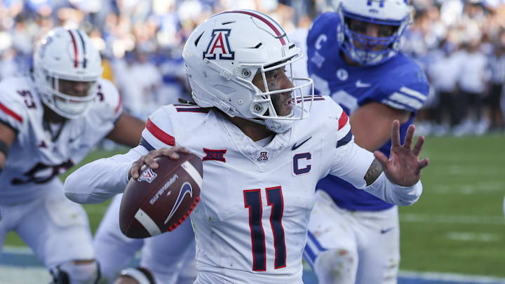 Oct 12, 2024; Provo, Utah, USA; Arizona Wildcats quarterback Noah Fifita (11) passes the ball from his own end zone against the Brigham Young Cougars during the fourth quarter at LaVell Edwards Stadium. Mandatory Credit: Rob Gray-Imagn Images Oct 12, 2024; Provo, Utah, USA; Arizona Wildcats quarterback Noah Fifita (11) passes the ball from his own end zone against the Brigham Young Cougars during the fourth quarter at LaVell Edwards Stadium. Mandatory Credit: Rob Gray-Imagn Images