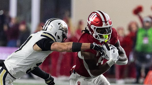Indiana Hoosiers running back Justice Ellison (6) runs the ball on Purdue Boilermakers defensive back Dillon Thieneman (31)