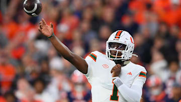 Nov 30, 2024; Syracuse, New York, USA; Miami Hurricanes quarterback Cam Ward (1) passes the ball against the Syracuse Orange during the first half at the JMA Wireless Dome. Mandatory Credit: Rich Barnes-Imagn Images