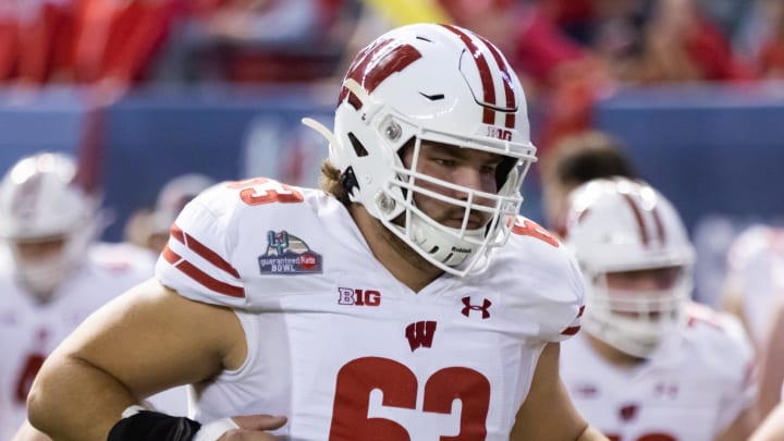 Wisconsin Badgers offensive lineman Tanor Bortolini (63) against the Oklahoma State Cowboys during the 2022 Guaranteed Rate Bowl at Chase Field.