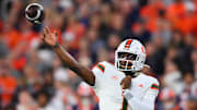Nov 30, 2024; Syracuse, New York, USA; Miami Hurricanes quarterback Cam Ward (1) passes the ball against the Syracuse Orange during the first half at the JMA Wireless Dome.