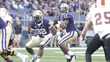Sep 21, 2013; Seattle, WA, USA; Washington Huskies quarterback Keith Price (17) looks to pass against the Idaho State Bengals during the second quarter at Husky Stadium. Mandatory Credit: Joe Nicholson-Imagn Images