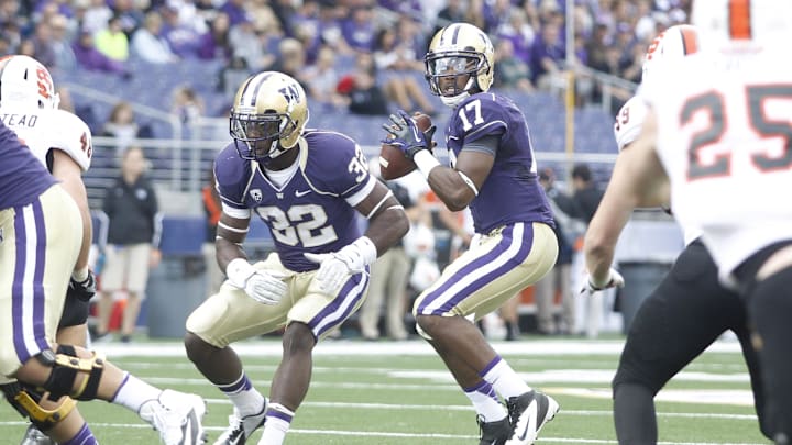 Sep 21, 2013; Seattle, WA, USA; Washington Huskies quarterback Keith Price (17) looks to pass against the Idaho State Bengals during the second quarter at Husky Stadium. Mandatory Credit: Joe Nicholson-Imagn Images