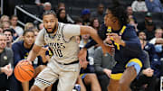 Georgetown Hoyas guard Jayden Epps (10) dribbles the ball past Marquette Golden Eagles guard Zaide Lowery (7) during the first half at Capital One Arena.