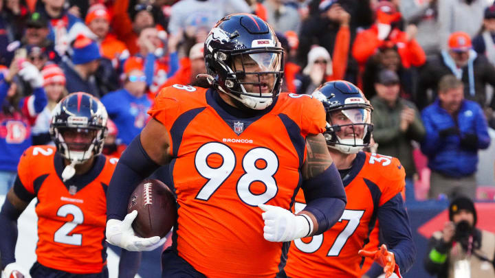 Nov 26, 2023; Denver, Colorado, USA; Denver Broncos defensive tackle Mike Purcell (98) following a defensive stop in the first quarter against the Cleveland Browns at Empower Field at Mile High. Mandatory Credit: Ron Chenoy-USA TODAY Sports