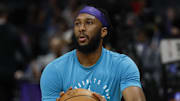 Apr 6, 2025; Charlotte, North Carolina, USA; Charlotte Hornets forward Josh Okogie (12) shoots before a game against the Chicago Bulls at Spectrum Center. Mandatory Credit: Nell Redmond-Imagn Images