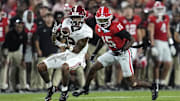 Sep 27, 2025; Athens, Georgia, USA; Alabama Crimson Tide wide receiver Ryan Williams (2) makes a catch against Georgia Bulldogs defensive back Demello Jones (15) in the first quarter at Sanford Stadium. Mandatory Credit: Dale Zanine-Imagn Images