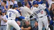 Oct 29, 2025; Los Angeles, California, USA; Los Angeles Dodgers first baseman Enrique Hernandez (8) celebrates with two-way player Shohei Ohtani (17) after hitting a home run against the Toronto Blue Jays in the third inning during game five of the 2025 MLB World Series at Dodger Stadium. Mandatory Credit: Jayne Kamin-Oncea-Imagn Images