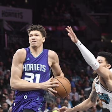 Apr 8, 2025; Charlotte, North Carolina, USA;  Charlotte Hornets forward Tidjane Salaun (31) drives in during the first half against the Memphis Grizzlies at the Spectrum Center. Mandatory Credit: Sam Sharpe-Imagn Images