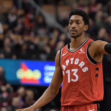 Nov 18, 2019; Toronto, Ontario, CAN;  Toronto Raptors guard Malcolm Miller (13) gestures to team mates as he dribbles the ball against Charlotte Hornets in the second half at Scotiabank Arena. Mandatory Credit: Dan Hamilton-Imagn Images