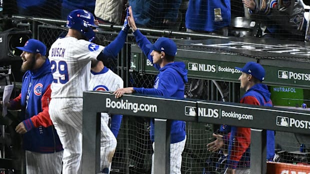 Michael Busch of Chicago Cubs high fives
