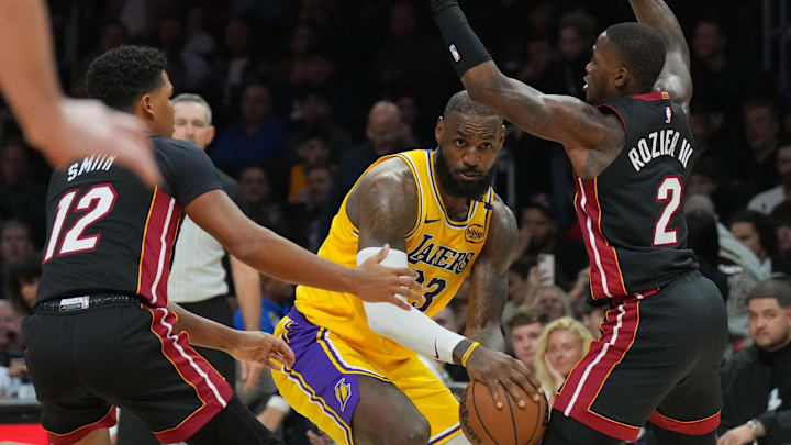 \Los Angeles Lakers forward LeBron James (23) looks to pass the ball as Miami Heat guard Terry Rozier (2) defends in the second half at Kaseya Center.