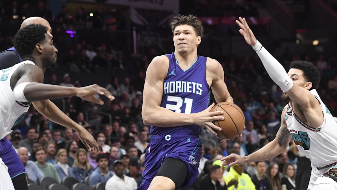 Apr 8, 2025; Charlotte, North Carolina, USA;  Charlotte Hornets forward Tidjane Salaun (31) drives in during the first half against the Memphis Grizzlies at the Spectrum Center. Mandatory Credit: Sam Sharpe-Imagn Images