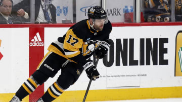 Pittsburgh Penguins right wing Bryan Rust (17) skates with the puck against the Nashville Predators.