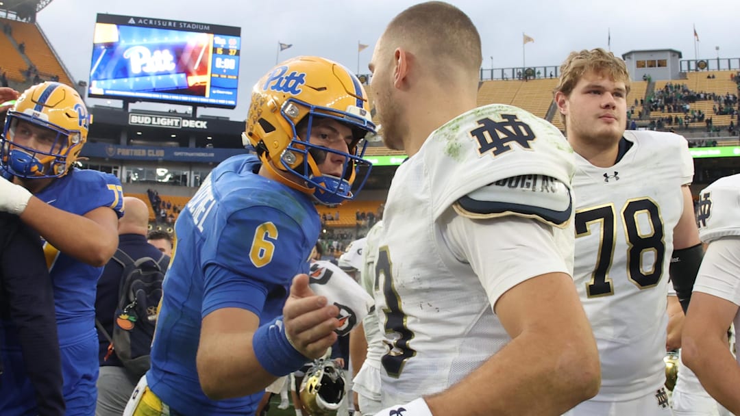 Nov 15, 2025; Pittsburgh, Pennsylvania, USA;  Pittsburgh Panthers quarterback Mason Heintschel (6) and Notre Dame Fighting Irish quarterback CJ Carr (13) shake hands after their game at Acrisure Stadium. Mandatory Credit: Charles LeClaire-Imagn Images
