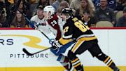 Dec 10, 2024; Pittsburgh, Pennsylvania, USA;  Colorado Avalanche center Nathan MacKinnon (29) and Pittsburgh Penguins center Sidney Crosby (87) in action during the first period at PPG Paints Arena. Mandatory Credit: Charles LeClaire-Imagn Images