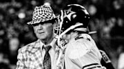 Alabama coach Bear Bryant, left, shakes the hand of Vanderbilt defensive back Steve Curnutte (21) at the end of the game on Sept. 29, 1973. The fifth-ranked Crimson Tide defeated Vanderbilt 44-0 before 34,000 fans at Dudley Field.