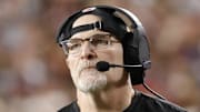 Dec 29, 2024; Landover, Maryland, USA; Washington Commanders head coach Dan Quinn looks on from the sidelines against the Atlanta Falcons during the second half at Northwest Stadium. Mandatory Credit: Amber Searls-Imagn Images