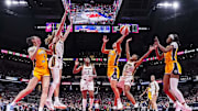 Jun 26, 2025; Indianapolis, Indiana, USA; Los Angeles Sparks guard Kelsey Plum (10) goes up for a basket against Indiana Fever guard Kelsey Mitchell (0) in the second half at Gainbridge Fieldhouse. Mandatory Credit: Grace Smith/INDIANAPOLIS STAR-Imagn Images