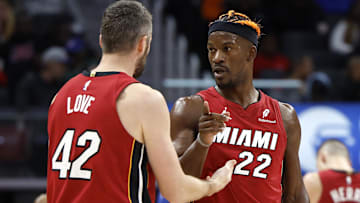 Dec 16, 2024; Detroit, Michigan, USA; Miami Heat forward Kevin Love (42) talks to forward Jimmy Butler (22) in the second half against the Detroit Pistons at Little Caesars Arena. Mandatory Credit: Rick Osentoski-Imagn Images