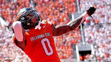 Oklahoma State's Ollie Gordon II (0) celebrates in the second half of the college football game between the Oklahoma State Cowboys and the Arkansas Razorbacks at Boone Pickens Stadium in Stillwater, Okla.,, Saturday, Sept., 7, 2024.