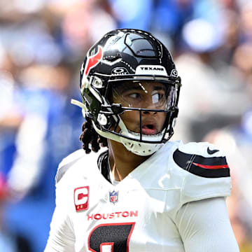 Sep 8, 2024; Indianapolis, Indiana, USA;  Houston Texans quarterback C.J. Stroud (7) looks for a teammate during the first quarter against the Indianapolis Colts at Lucas Oil Stadium. Mandatory Credit: Marc Lebryk-Imagn Images