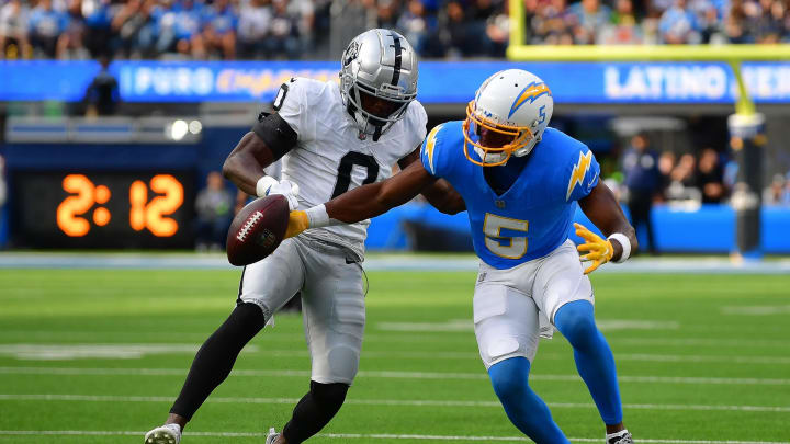 Oct 1, 2023; Inglewood, California, USA; Las Vegas Raiders cornerback Jakorian Bennett (0) blocks a pass intended for Los Angeles Chargers wide receiver Joshua Palmer (5) during the second half at SoFi Stadium. Mandatory Credit: Gary A. Vasquez-USA TODAY Sports