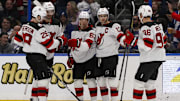 Mar 19, 2023; Tampa, Florida, USA; New Jersey Devils left wing Jesper Brett (63) celebrates with defenseman Damon Severs (28), center Nico Hischier (13), right wing Timo Meier (96) and defenseman Kevin Bahl (88) after a goal during the second period at Amalie Arena. Mandatory Credit: Morgan Tencza-Imagn Images