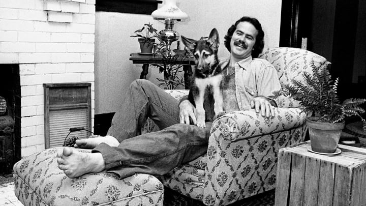 Singer-songwriter Dave Loggins is relaxing at his home on June 5, 1974, with his puppy.