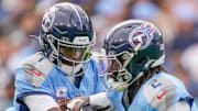 Tennessee Titans quarterback Cam Ward (1) hands off to running back Tyjae Spears (2) during the first quarter against the New England Patriots at Nissan Stadium in Nashville, Tenn., Sunday, Oct. 19, 2025.