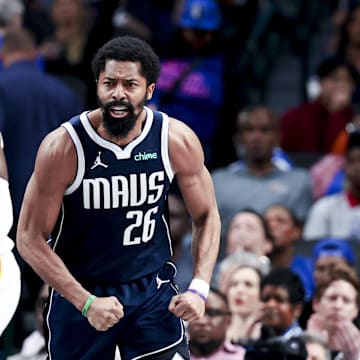 Apr 2, 2025; Dallas, Texas, USA;  Dallas Mavericks guard Spencer Dinwiddie (26) reacts in fron tof Atlanta Hawks forward Onyeka Okongwu (17) after scoring during the fourth quarter at American Airlines Center. Mandatory Credit: Kevin Jairaj-Imagn Images